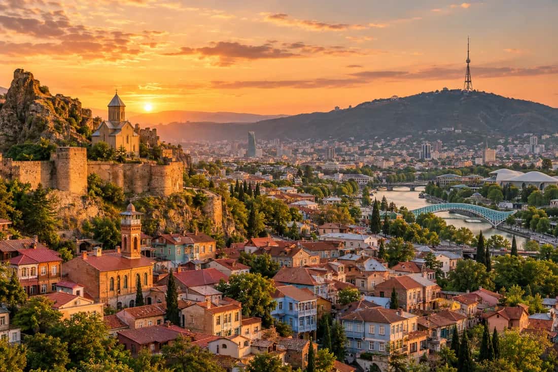 Illustration of Tbilisi at sunset with Mtatsminda in the background